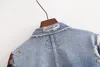 Cappotti di giacche di jeans da donna con ricami floreali alla moda che lavano i vecchi capispalla casual da donna con nappe con fori dannosi