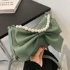Sommar liten färsk pärla kedja all-match axelväska 2021 mode kvinnors designer båge bärbar budbärare kors kropp