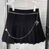 Casual Black Patchwork Chain Mini kjol för kvinnor Hög midja Preppy Style Plisserade kjolar Kvinna sommar mode kläder 210531