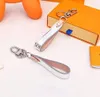 Alta Qualtiy Couro Marca Designer Keychain Moda 2 Estilos Penhasco Pingente Corrente de Carro Charm Bag Keyring Presentes de Trinket Acessórios com Box Jon21