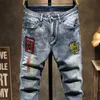 Hommes européens dsq marque Slim Jeans Denim pantalon Stretch bleu Patchwork trou pantalon pour hommes déchiré Jeans JS1059 X0621