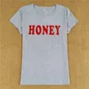 Camiseta feminina letra de mel com impressão de algodão camiseta feminina manga curta o pescoço solto camiseta amarela 2022 camiseta feminina de verão camisetas camisetas