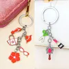 Keychains Fashion Girls Summer Dressing Style Keychain Red Color Hat Glasögon toffel Emalj Keyring Women Bag Mobiltelefon hängande hänge