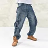 男性のジーンズの男性のカジュアルな貨物のズボンのマルチポケットの緩いフィットのヒップホップデニムのズボンの男性のバギープラスサイズ30-461