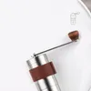 滑り止めカップホルダーキッチンツールが付いている携帯用手動のコーヒーグラインダー小型のステンレス鋼の手動のコーヒー豆のグラインダーのミル
