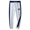 Light Luxury White Badge Embroidered Casual Sports Pants Men's Woven Foot Trousers Side Webbing