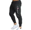 Marque lettre impression Muscle Fitness pantalons de course entraînement sport coton pantalon hommes respirant mince faisceau bouche décontracté He223S