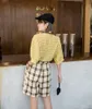 Pantalones cortos informales de pierna ancha de cintura alta de verano a cuadros amarillos para mujer cómodos coreanos 210427