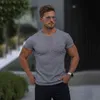 Gym T-shirt Män Kortärmad Stickad Tshirt Sport Strips Slim Tee Shirt Man Fitness Bodybuilding Workout Topps Sommar kläder 210421