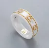 Bandpaarringe gravierte Buchstaben Gu Jia Icon Serie Gold ineinandergreifend Doppelg Ring Neue überlappende Diamantwinkel für Liebhaber Designer 237f