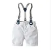 Gentleman-Stil Baby-Jungen-Kleidungssets Sommer Kinder Kurzarm kariertes Hemd mit Fliege + Hosenträger-Shorts 2-teiliges Set Kinderanzug Jungen-Outfits 1-7 Jahre