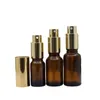 Lozione spray d'oro Pompa per pressa Emulsione Bottiglia riutilizzabile Profumo di vetro marrone vuoto Fiale per contenitori di imballaggio cosmetico 5ml 10ml 20ml 30ml 50ml 100ml