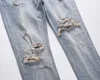 Herrenjeans High-Street-Fashion-Marke, schmal geschnittene Used-Jeans mit Loch und Katzenbart