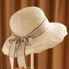 Cappelli da sole pieghevoli con cappello di paglia floppy a tesa larga con bowknot Cappellini da spiaggia ombreggianti con protezione elegante per le donne