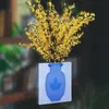vaso de plantas artificiais