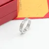 Bague à ongles classique à la mode pour femmes hommes plein Cz cristal en acier inoxydable amour luxe 18 carats vis en or anneaux de mariage E1911