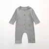 Botão de manga comprida de algodão Onesie Baby Macipers Autum Unisex Recém-nascido Roupas de Bebê Sólida Vestuário infantil 3-36m