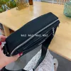 2022 Nylon Designer Men Bortes pretos Bolsas de ombro de moda Bolsas de câmera Crossbody Triângulo Mulheres à prova d'água PU318H