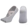 Fasciatura da donna Antiscivolo Puntini in silicone ad asciugatura rapida Calzini da massaggio per yoga Cotone traspirante Aperto 5 dita senza dita Calzino Pantofola Calzino da allenamento per casa con impugnatura