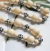 Chaîne de perles en bois décor à la maison patché couleur treillis perles en bois créatif corde de chanvre gland perlé pendentif Style nordique décoration de pays à la main WMQ1337