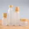 2022 NEW Frosted Glass Jar Lotion Cream Bottles Round Cosmetic Jars Hand Face Lotion Pump Bottle with wood grain cap