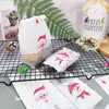 ギフトラップ50ピースプラスチックキャンディクッキーバッグクリスマスツリーの飾り漫画犬猫スナック包装袋子供の誕生日パーティーの装飾