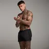 Odzież marki mężczyźni spodenki plażowe męskie letnie spodenki dla mężczyzn krótkie majtki męskie fitness siłownia spodenki masculino ubrania 210421