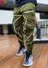 Rainbowtouches Pantaloni sportivi da uomo all'aria aperta Frangivento Multi tasca Pantaloni sportivi cargo riflettenti a righe casuali Qualità superiore G1007