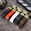 Top Luxury Fashion Designer Straps Handgjorda PU Läder Bil Keychain Kvinnor Väska Charm Pendant Tillbehör