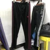 Pantaloni da uomo 20FW Needles Uomo Donna Classico Farfalla Logo ricamato Pantaloni della tuta AWGE Pantaloni a righe laterali multicolore