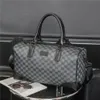 Ontwerpers Duffel Bags Luxe Men Vrouwen vrouwelijke reistassen brief afdrukken lederen handtassen grote capaciteit Holdall draagtje 248NN