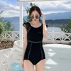 Kvinnors badkläder 2021 Asia Japan Sydkorea One Piece Swimsuit Women Black White Colors Backless Young Girl Spring