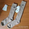 Men's socks Italian m.k light luxury niche autumn winter double wool thick needle versatile women's medium and high barrel solid color