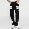 Pantalones vaqueros de moda para hombre, pantalones vaqueros rasgados Y2k con bordado gráfico de calavera para hombre, ropa de calle estilo Harajuku Vibe, pantalones vaqueros informales de gran tamaño