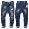 Jeans da uomo Uomo di marca Uomo Blu scuro Stretch Allentato Strappato Distressed Pantaloni streetwear in denim Pantaloni retrò casual Hiphop Jean Homme