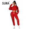 Active Wear Sporty Jogging Suit pour femmes Tenues décontractées Off épaule à manches longues Sweat à capuche + trou Sweatpant 2 pièces Ensembles 210525