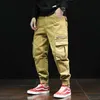 Mężczyźni Duże kieszenie Casual Cargo Spodnie Mężczyzna Moda Hip Hop Punk Harem Spodnie Jogger Spodnie dresowe Black Street Wear Spodnie Y0927