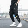 Tasche laterali da uomo Cargo Harem Pants Nastri Black Hip Hop Casual Pantaloni da jogging maschili Moda Streetwear 210715
