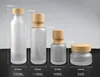 2022 NEW Frosted Glass Jar Lotion Cream Bottles Round Cosmetic Jars Hand Face Lotion Pump Bottle with wood grain cap