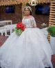 Arabo Aso Ebi Plus Size Abiti da sposa 2022 di lusso a maniche lunghe in pizzo Applique in rilievo africano Sheer Neck Princess Abito da sposa