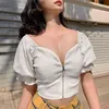 T-shirt das mulheres Irene Ribbed Short Flare Manga Crop Tops Mulheres Verão Sexy V Pescoço Branco Design Zip Skinny Camisas Top 2022