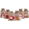 Jul Burlap Linne Drawstring Bag Present Wraps Santa Claus Snögubbe Penguin Elk Candy Smycken Förpackning Presentförvaring Väskor Xmas Favoriter Dekoration