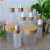 Partihandel Amber / Svart Frostat / Vit / Klar plastflaskor och gräddeburkar Bamboo Cap Bottle Cosmetic Containers Jar Bulkgoods