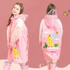 Bambini ragazza / ragazzo cappotto pioggia carino cartone animato cartoon stampato vestiti rosa / blu / giallo impermeabile impermeabile tuta con cappuccio pioggia con cappuccio 211204