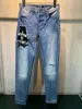 Mens jeans knähål nyaste designer rippad rak motorcykel tvättad biker tunga industrin slips färga byxor för man hoodie kvinnor högkvalitativ känd märke denim pant