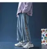 New cartoon print jeans men's loose fall straight-leg pants Korean style trend stitching casual nine-point spring blue 0309