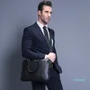 Promotion Simple célèbre marque hommes d'affaires porte-documents sac de luxe en cuir pochette d'ordinateur homme sac à bandoulière bolsa maleta