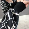 Marque Design pull décontracté printemps femmes dentelle couture tricot élégant imprimé léopard noir tricot haut 211011