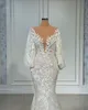 2022 Nuovi abiti da sposa a sirena a maniche lunghe Collo trasparente con perline floreali in rilievo tromba africana Fishtail Beach Aso Ebi Abito da sposa1749772