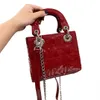 patent leder cross body bag